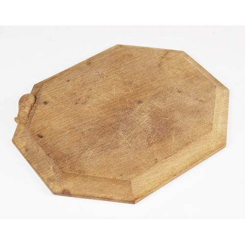 181 - Workshop of Robert 'Mouseman' Thompson, Kilburn, an octagonal breadboard, carved trademark mouse to ... 