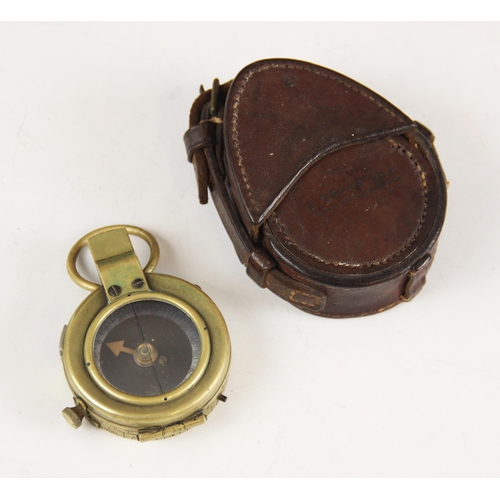 196 - A cased WWI military brass bodied pocket compass, the base with broad arrow, serial number F-L No.12... 