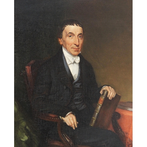 358 - English school (19th century),  
A half length portrait of a seated gentleman holding a book,  
Oil ... 