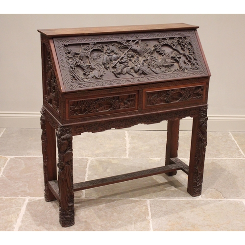 384 - A Chinese relief carved hardwood bureau, 20th century, the fall front carved with warriors on horse ... 