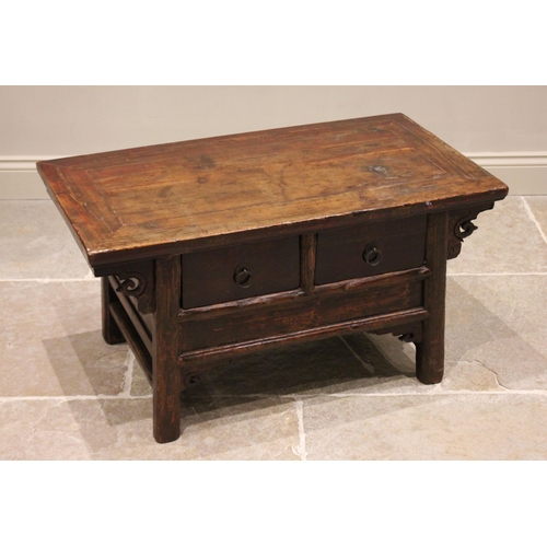 389 - A Chinese elm coffee table, 20th century, the cleated plank top above two frieze drawers, raised upo... 