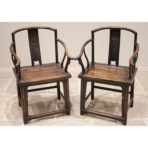 390 - A pair of Chinese elm altar chairs, the splat backs centred with a carved shou symbol, above the boa... 