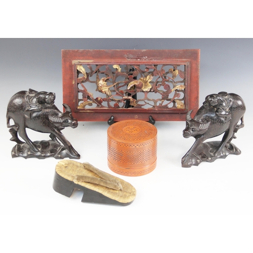 413 - A pair of Chinese hardwood models of water buffalo and riders, each 18cm high, with an oriental pier... 