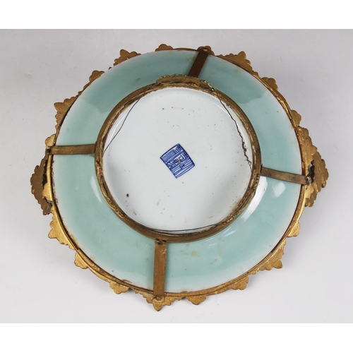 420 - A Chinese porcelain Celadon comport, 19th century, the gilt metal mounted dish decorated in a famill... 