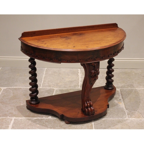 774 - A Victorian mahogany demi lune side table, the moulded top above a frieze applied with a blind fretw... 