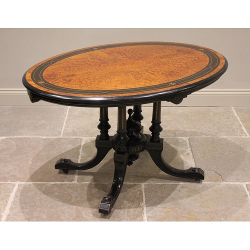 780 - A Victorian birds eye maple and ebonised Aesthetic Movement loo table, the quarter veneered oval til... 