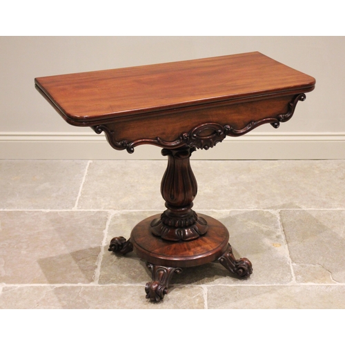 783 - A Victorian mahogany pedestal tea table, the rectangular folding top with rounded front corners abov... 