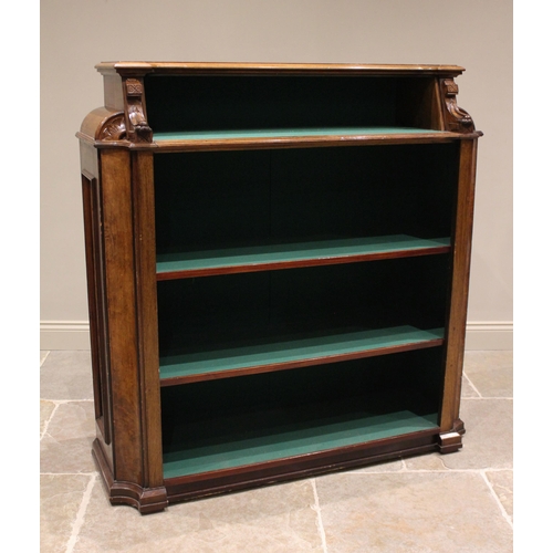 790 - A Victorian walnut open bookcase, with a baize lined interior, the recessed top shelf enclosed by ca... 