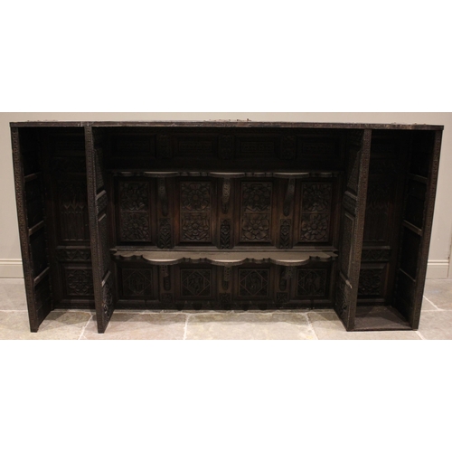 792 - A substantial 19th century carved oak sideboard back, profusely carved with flowerhead and geometric... 