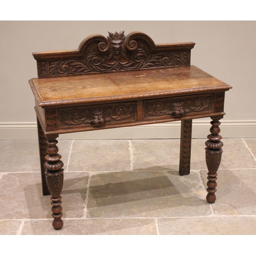 798 - A Victorian carved oak side table, the galleried back centred with a Green Man mask enclosed by scro... 