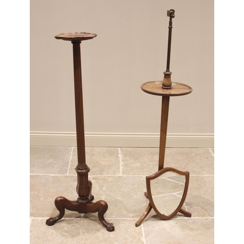 808 - A 19th century style mahogany torchere, early 20th century, the shaped top with a moulded rim raised... 