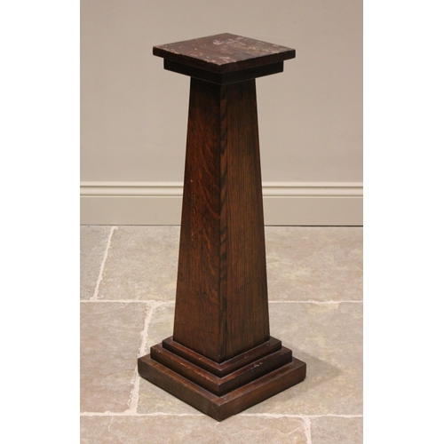 822 - An oak pedestal jardinière stand, 20th century, the square tapering column extending to a stepped pl... 