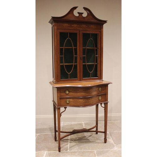 825 - An Edwardian inlaid mahogany display cabinet on chest, in the manner of Edwards & Roberts, with a tw... 