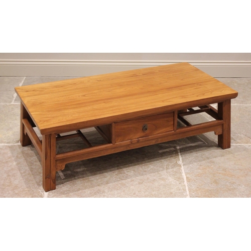 836 - A contemporary Chinese influence golden elm coffee table, early 21st century, the rectangular slab t... 