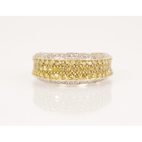 85 - A white and yellow diamond 14ct gold ring, the central recessed pave set with three rows of coloured... 