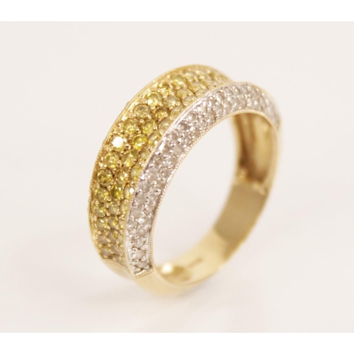 85 - A white and yellow diamond 14ct gold ring, the central recessed pave set with three rows of coloured... 