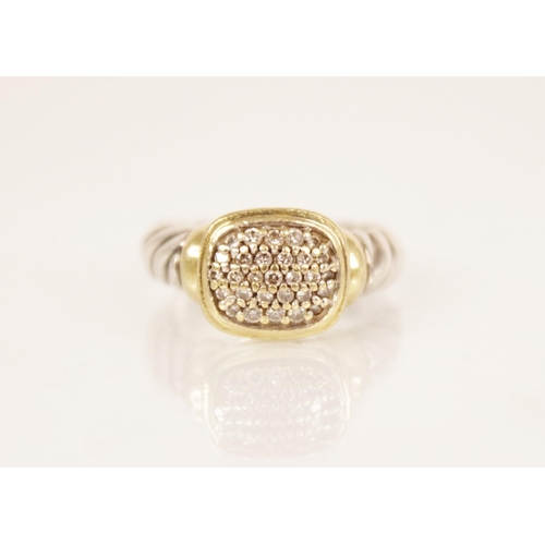 86 - A diamond cluster ring by David Yerman, the central rounded rectangular head pave set with diamonds,... 