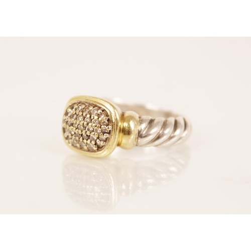 86 - A diamond cluster ring by David Yerman, the central rounded rectangular head pave set with diamonds,... 