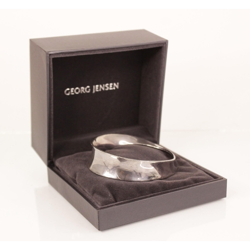 89 - A Georg Jensen Mobius silver bangle, designed by Vivianna Torun, no. 206, Georg Jensen oval mark, 8.... 