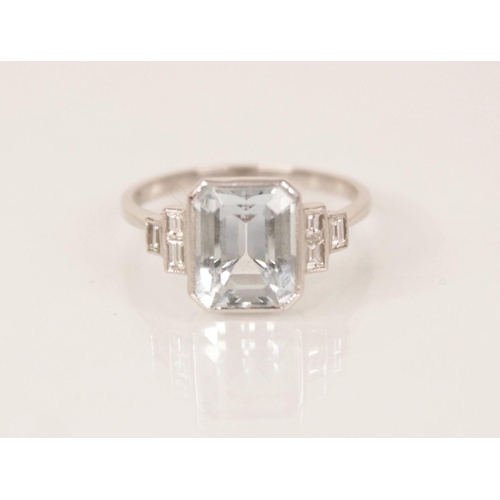 162 - An Art Deco aquamarine and diamond ring, the central emerald cut aquamarine measuring 9.5mm x 7.6mm ... 