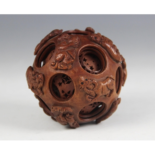 171 - A Chinese carved wood Zodiac puzzle ball, the exterior carved with the twelve Chinese Zodiac animals... 