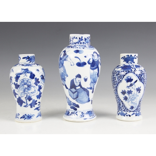 388 - Three Chinese blue and white porcelain vases, 19th century, each of baluster form, individually deco... 