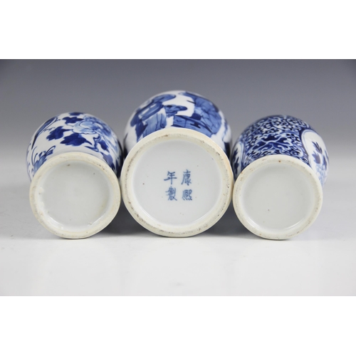 388 - Three Chinese blue and white porcelain vases, 19th century, each of baluster form, individually deco... 