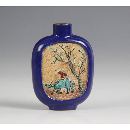 421 - A Chinese blue-ground Yixing stoneware snuff bottle, 19th century, decorated with two reserves depic... 