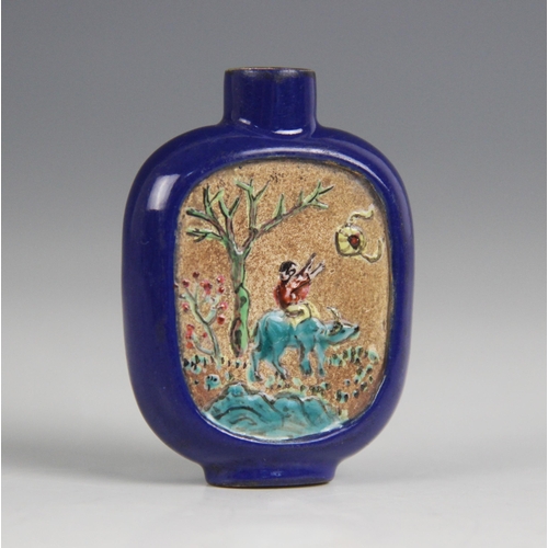 421 - A Chinese blue-ground Yixing stoneware snuff bottle, 19th century, decorated with two reserves depic... 