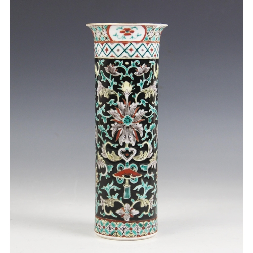 423 - A Chinese porcelain famille noir sleeve vase, 19th/20th century, of typical cylindrical form and dec... 