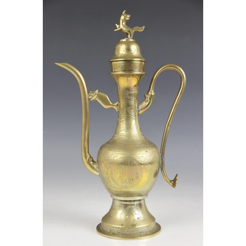 424 - A Tibetan brass ewer and cover, 20th century, of Islamic/Persian form, with Buddhistic decoration an... 