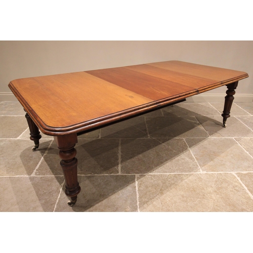 791 - A Victorian mahogany extending dining table, the rectangular moulded top with rounded corners, raise... 