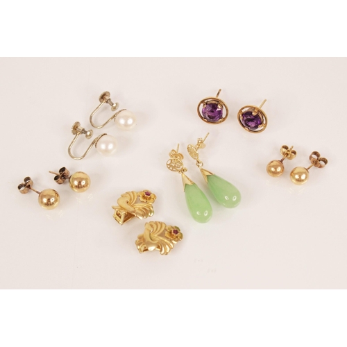 161 - A selection of vintage dress earrings, to include a pair of ruby set gold coloured floral clip on ea... 