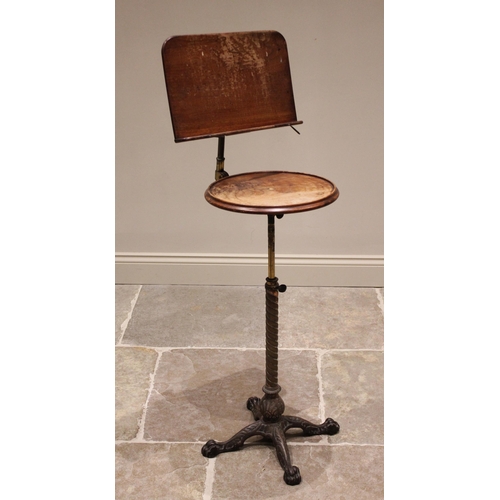 768 - A Victorian music stand by Leveson & Sons, London, the adjustable sheet music holder above a circula... 