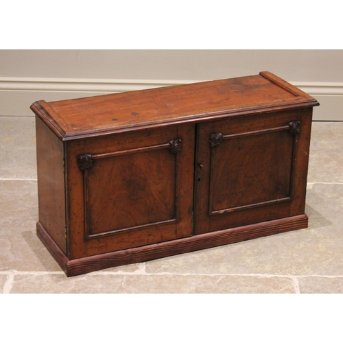 769 - A Victorian mahogany desk top cabinet, the twin doors opening to six pigeon holes and five small dra... 