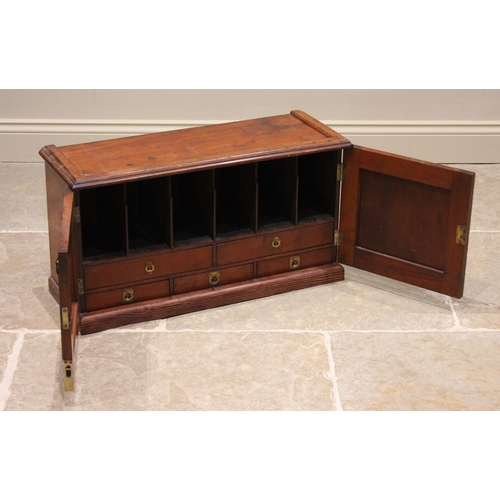 769 - A Victorian mahogany desk top cabinet, the twin doors opening to six pigeon holes and five small dra... 