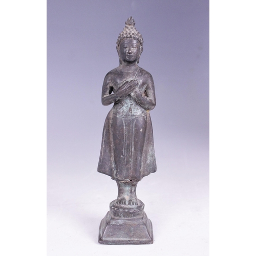 399 - A selection of South East Asian objet d'art, 20th century, to include a small bronze figure of conte... 