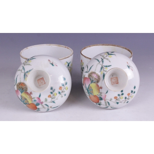 407 - A pair of Chinese porcelain cups and covers, Republic Period, each of cylindrical form and painted w... 