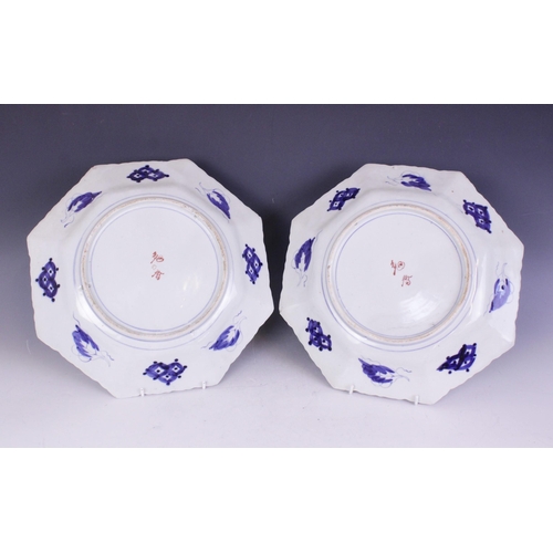 432 - Two Japanese famille rose chargers, 20th century, each of octagonal form and decorated with figures,... 