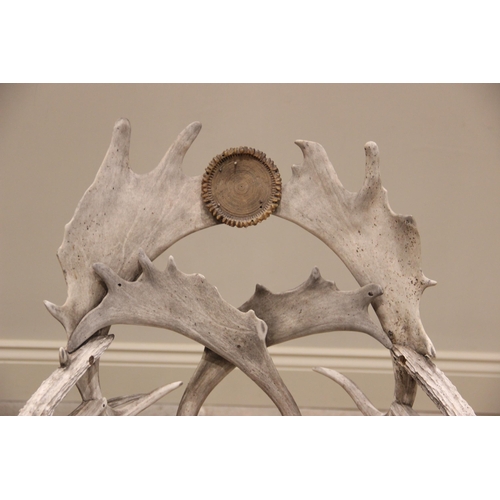 788 - A pair of 19th century red and fallow deer antler chairs, the oak seats overlaid with antler bark ra... 