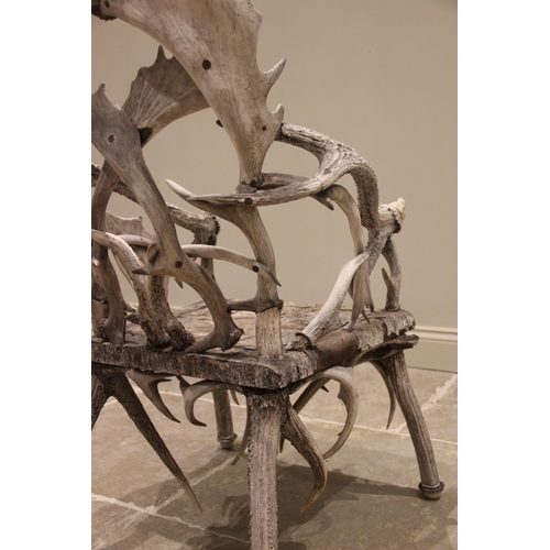 788 - A pair of 19th century red and fallow deer antler chairs, the oak seats overlaid with antler bark ra... 