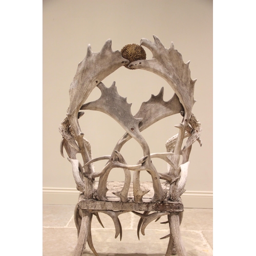 788 - A pair of 19th century red and fallow deer antler chairs, the oak seats overlaid with antler bark ra... 