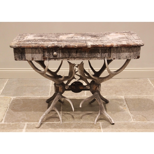 789 - A 19th century antler console table, the rectangular pine table top overlaid with antler bark, and c... 