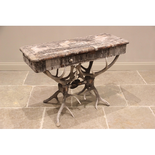 789 - A 19th century antler console table, the rectangular pine table top overlaid with antler bark, and c... 