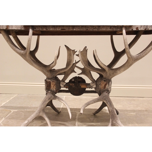 789 - A 19th century antler console table, the rectangular pine table top overlaid with antler bark, and c... 