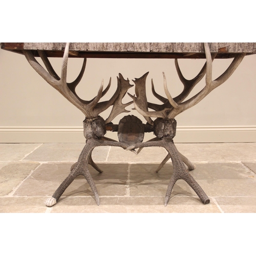 789 - A 19th century antler console table, the rectangular pine table top overlaid with antler bark, and c... 