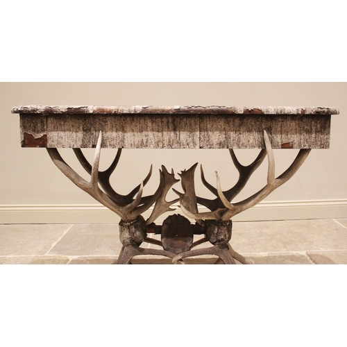 789 - A 19th century antler console table, the rectangular pine table top overlaid with antler bark, and c... 