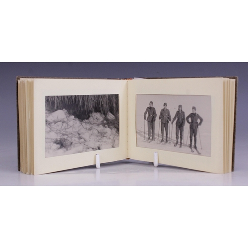 193 - WORLD WAR II INTEREST: A WWII German photograph album containing thirty seven 6cm x 9cm monochrome p... 