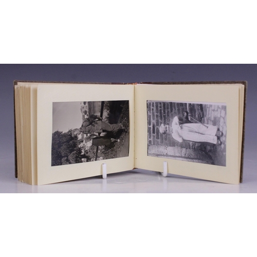 193 - WORLD WAR II INTEREST: A WWII German photograph album containing thirty seven 6cm x 9cm monochrome p... 