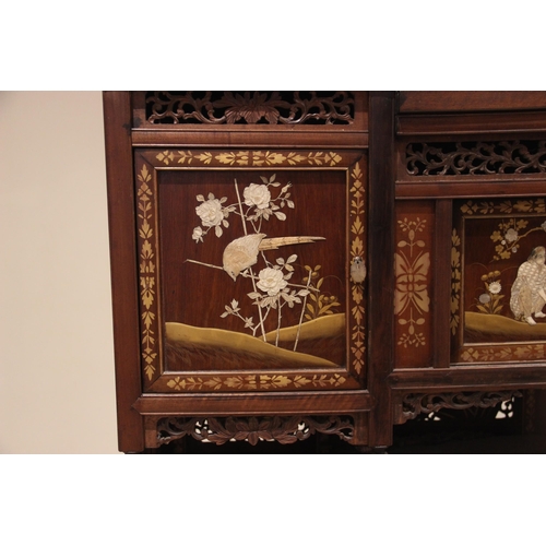 429 - A Japanese shibayama cabinet, early 20th century, with an open work foliate gallery above a conformi... 